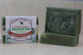 Green soap bars with 'HBMR Soap Co.' packaging on a white background